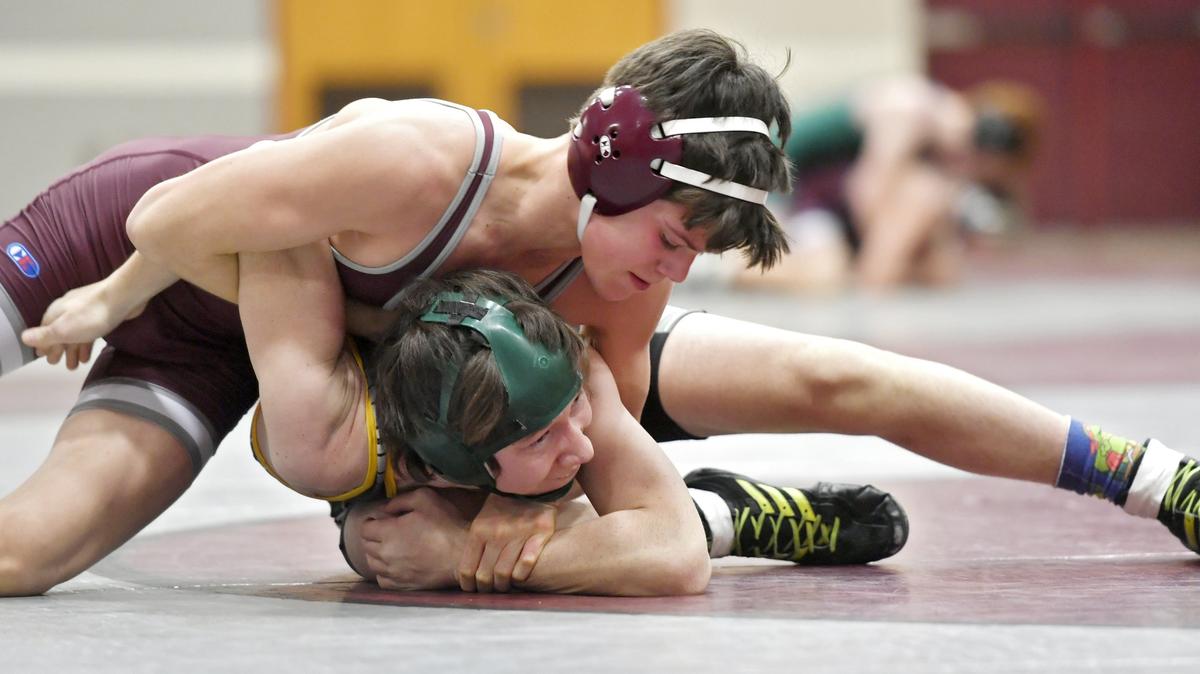 State College’s Jude Swisher controls Carlisle’s Clayton Shughart in the 113 lb bout during the match on Monday, Feb. 4, 2019. Swisher won by tech fall.