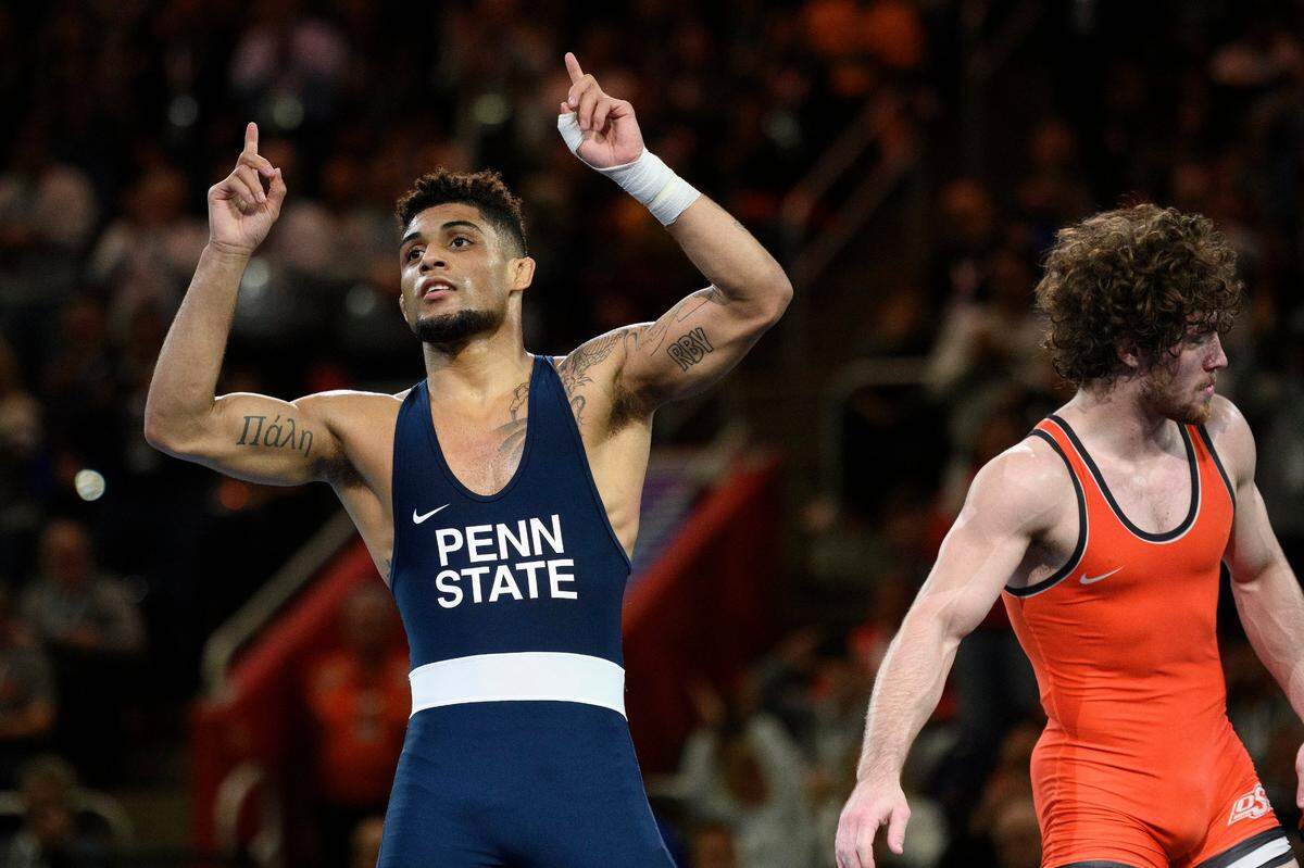 Penn State’s Roman Bravo-Young celebrates his win over Oklahoma State’s Daton Fix during their 133-pound match at the 2022 NCAA Division Wrestling Championships in Detroit on March 19. Bravo-Young announced Monday that he’ll return to the Penn State next season.