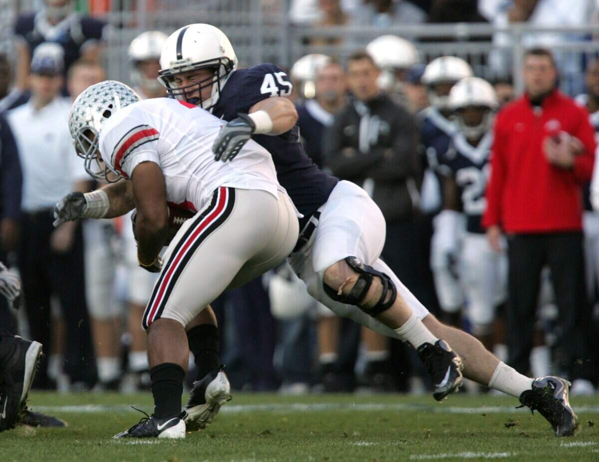 Penn State’s Sean Lee tackles Ohio State’s Brandon Saine at Beaver Stadium on Saturday, Nov. 7, 2009.