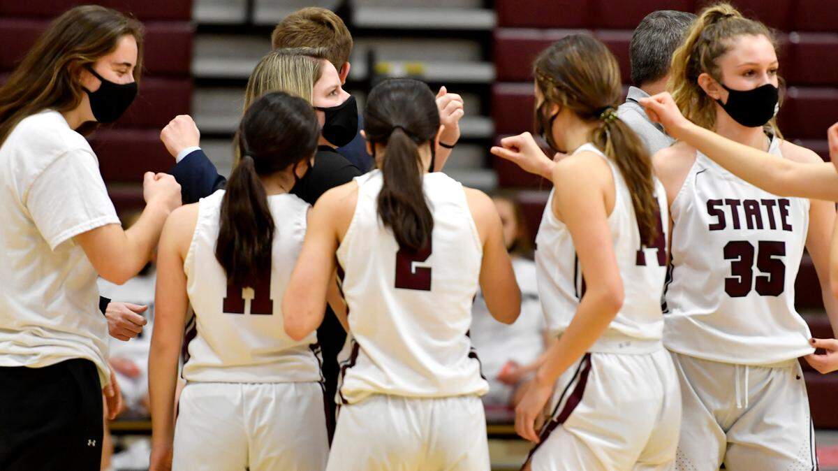 State College girls basketball coach Alli Mock talks to her team before the game against Central Dauphin on Wednesday, Feb. 24, 2021.