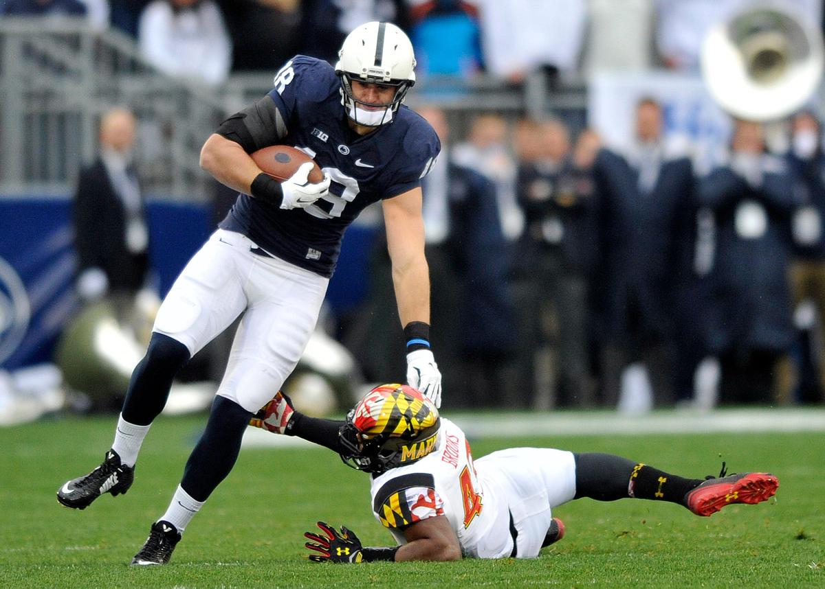 Penn State’s Jesse James eludes Maryland’s Jalen Brooks.