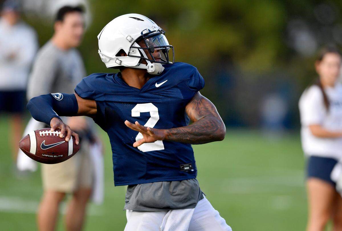 Penn State quarterback Ta’Quan Roberson makes a pass during practice on Wednesday, Oct. 13, 2021.