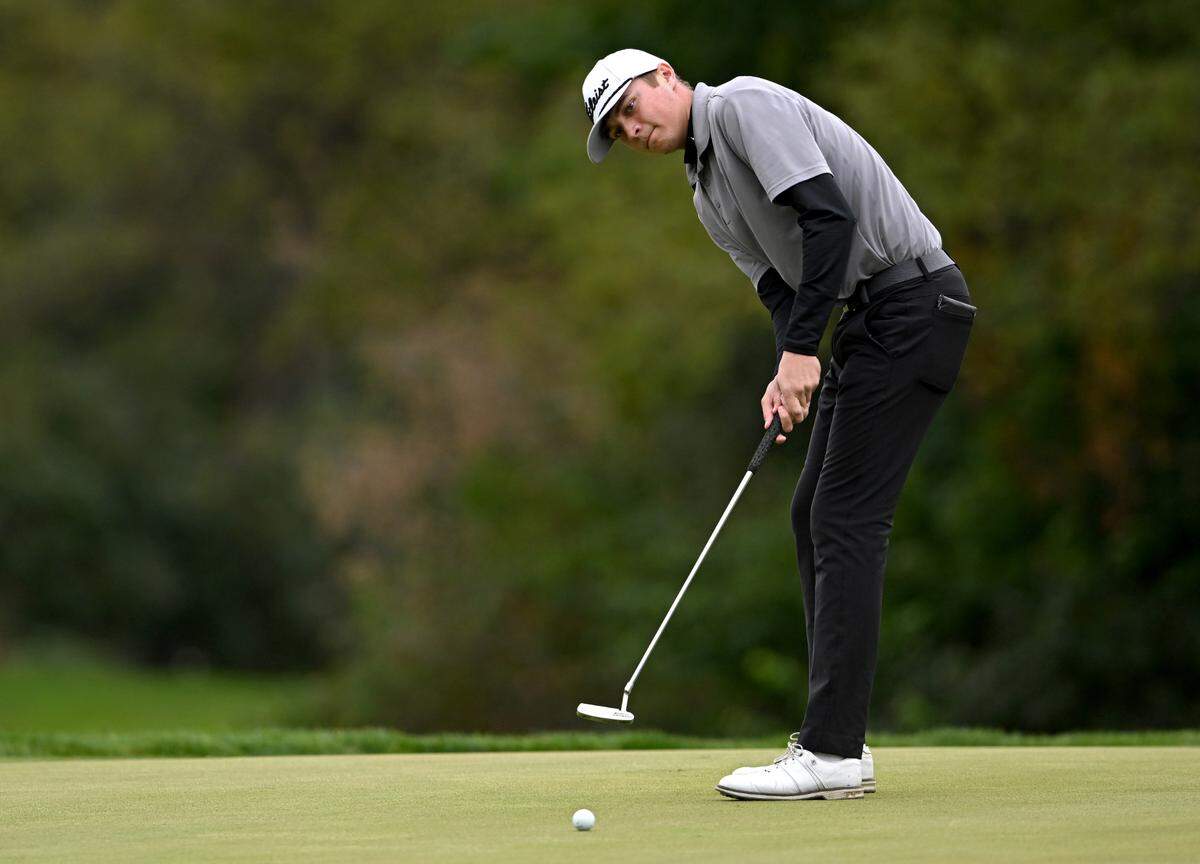 State College’s Max Wager putts on the 17th green during the PIAA golf championships at the Penn State Golf Courses on Tuesday, Oct. 17, 2023.