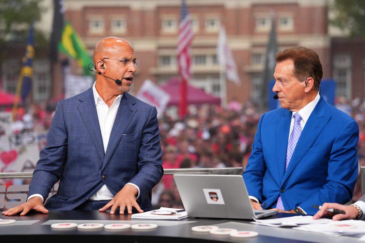 Former Penn State coach James Franklin talks with ESPN analyst and former Alabama coach Nick Saban during a segment on ESPN’s College GameDay on Saturday, Oct. 18, 2025, in Athens, Georgia, ahead of the Ole Miss-Georgia game.