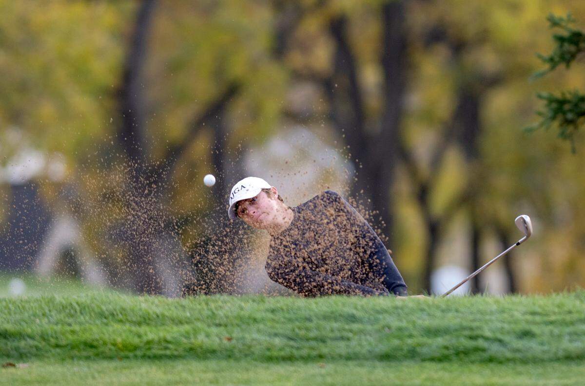 State College’s Max Wager chips onto the green as he competes in the PIAA golf championships on Monday, Oct. 17, at the Penn State Golf Courses.