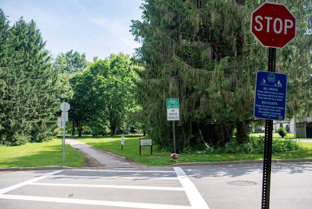 A stop sign for cyclists on the bike path where it crosses Edgewood Circle on Thursday, June 16, 2022.