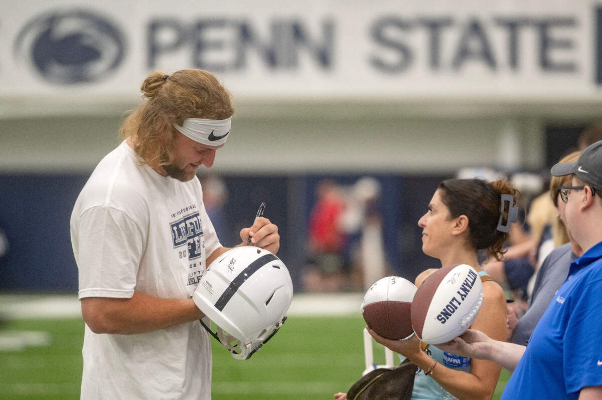 Penn State tight end Tyler Warren signs autographs for fans during the 21st Annual Lift for Life to benefit Uplifting Athletes on Thursday, June 13, 2024 in Holuba Hall.