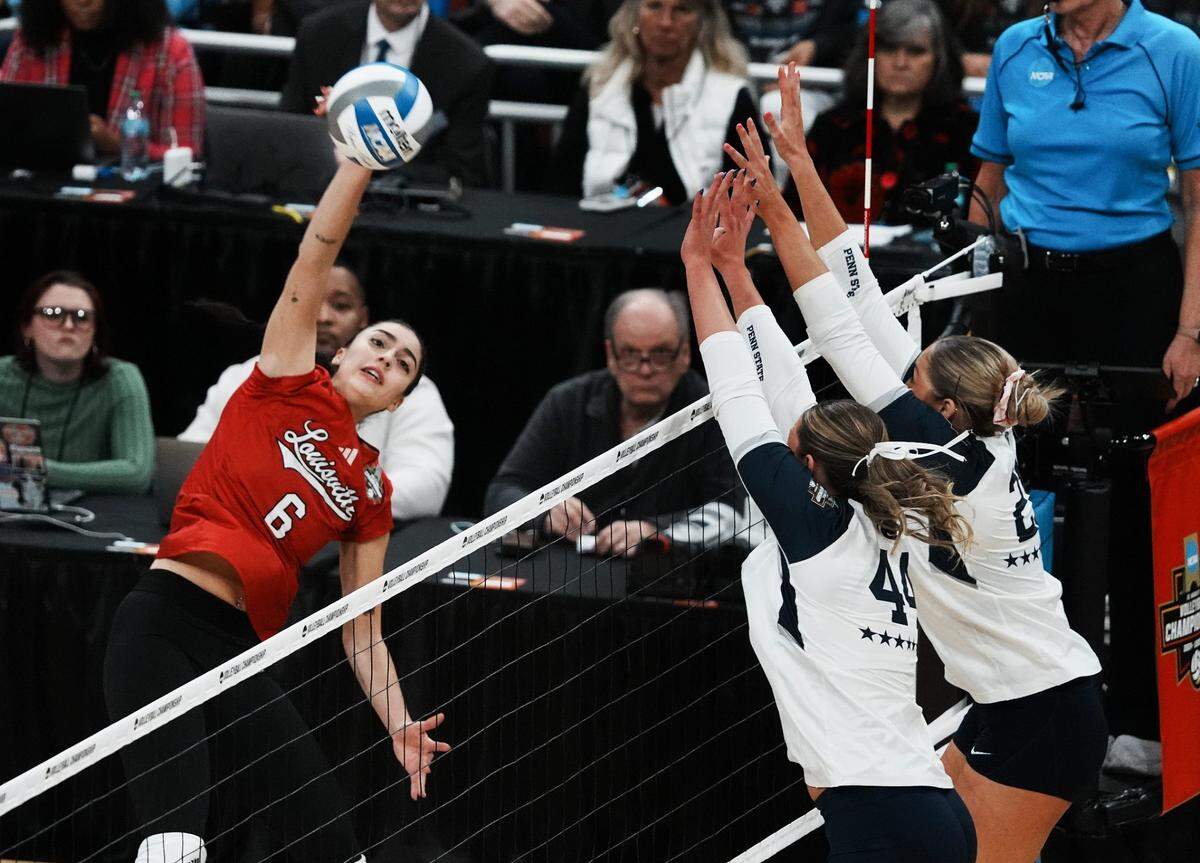 Louisville's Sofia Maldonado Diaz (6) tries to get a ball past the Penn State defense during the NCAA Championship Volleyball match at the KFC Yum! Center in Louisville, Ky. on Dec. 22, 2024.
