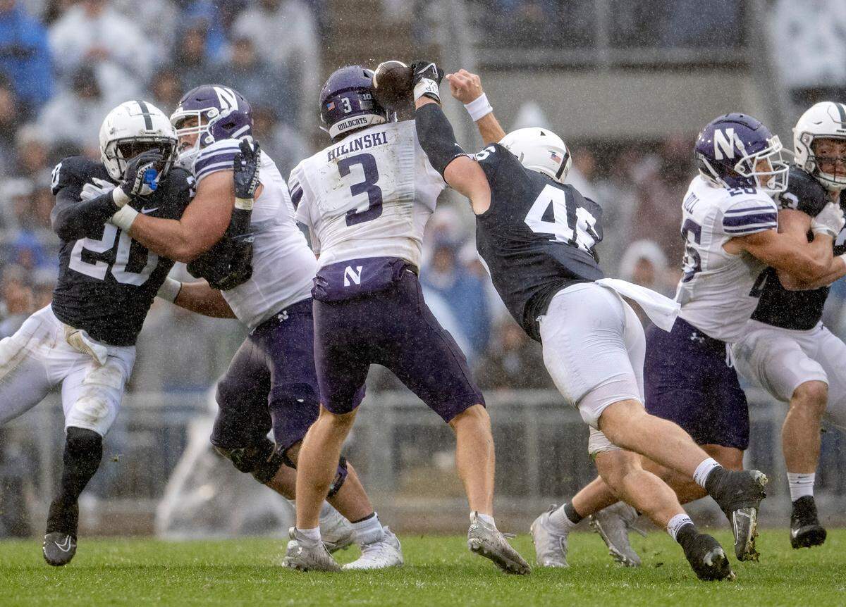 Penn State defensive end Nick Tarburton knocks the ball away from Northwestern’s Ryan Hilinski during the game on Saturday, Oct. 1, 2022.