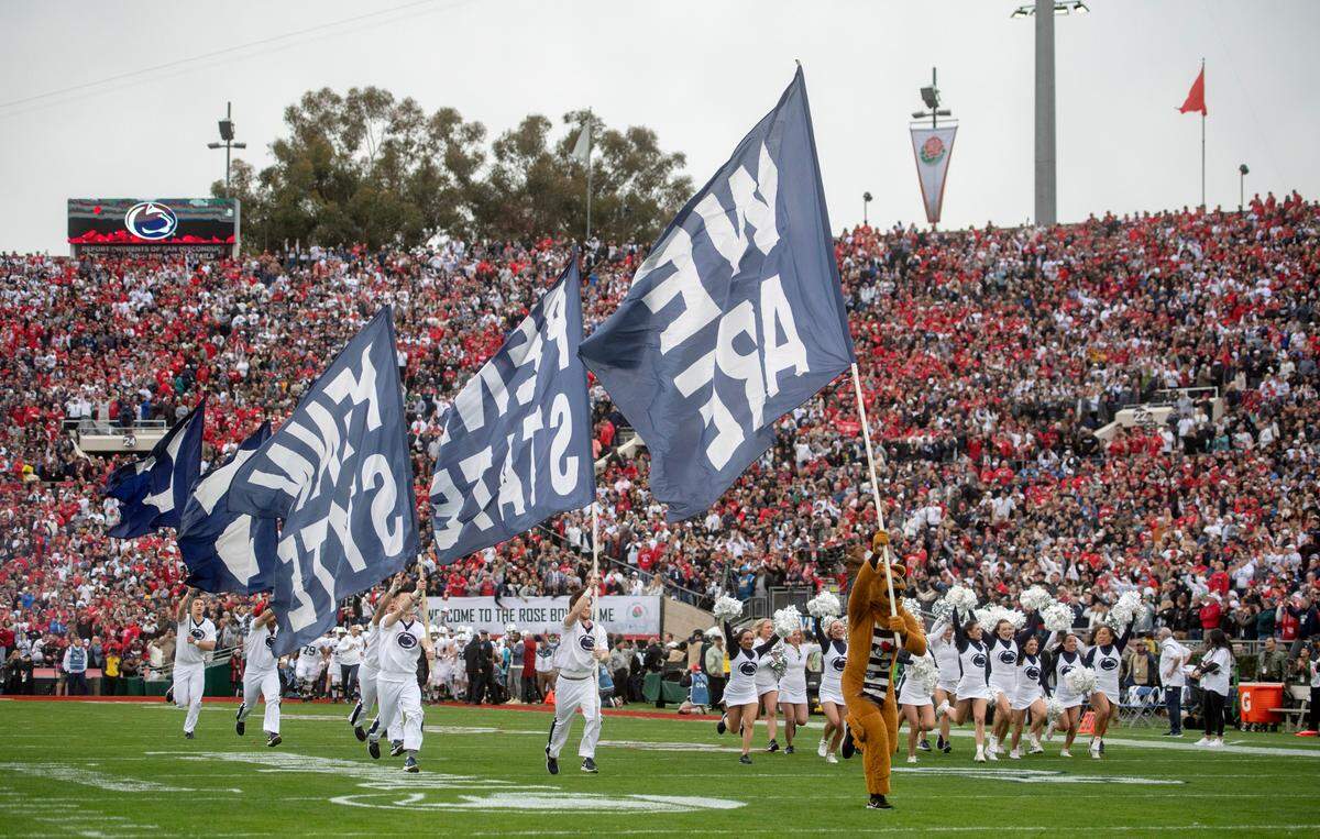 The Penn State Nittany Lion and cheerleaders run out before the team for the Rose Bowl against Utah on Monday, Jan. 2, 2023.