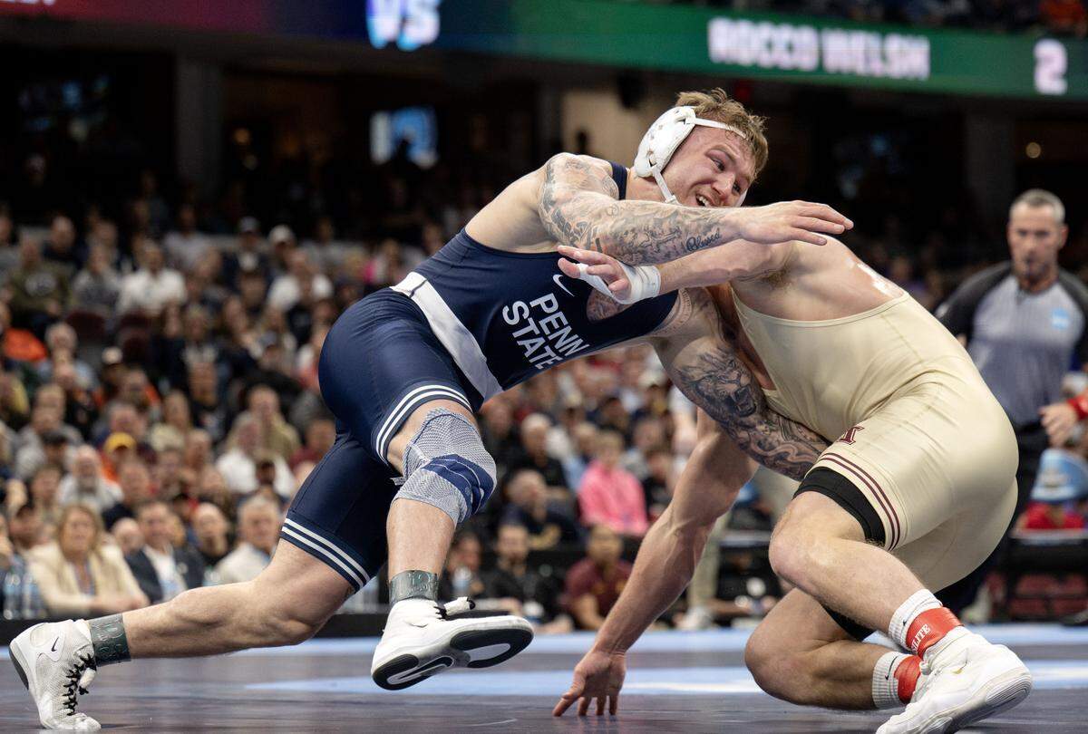 Penn State's Rocco Welsh reaches for Minnesota’s Max McEnelly as the time winds down in their 184-pound championship bout at the NCAA wrestling championships on Saturday, March 21, 2026.