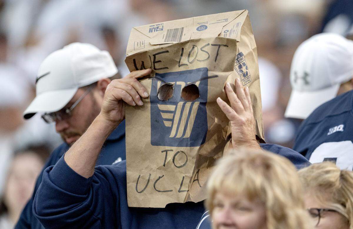A Penn State fan put a bag over his head that says “We lost to UCLA” during the game against Northwestern on Saturday, Oct. 11, 2025.
