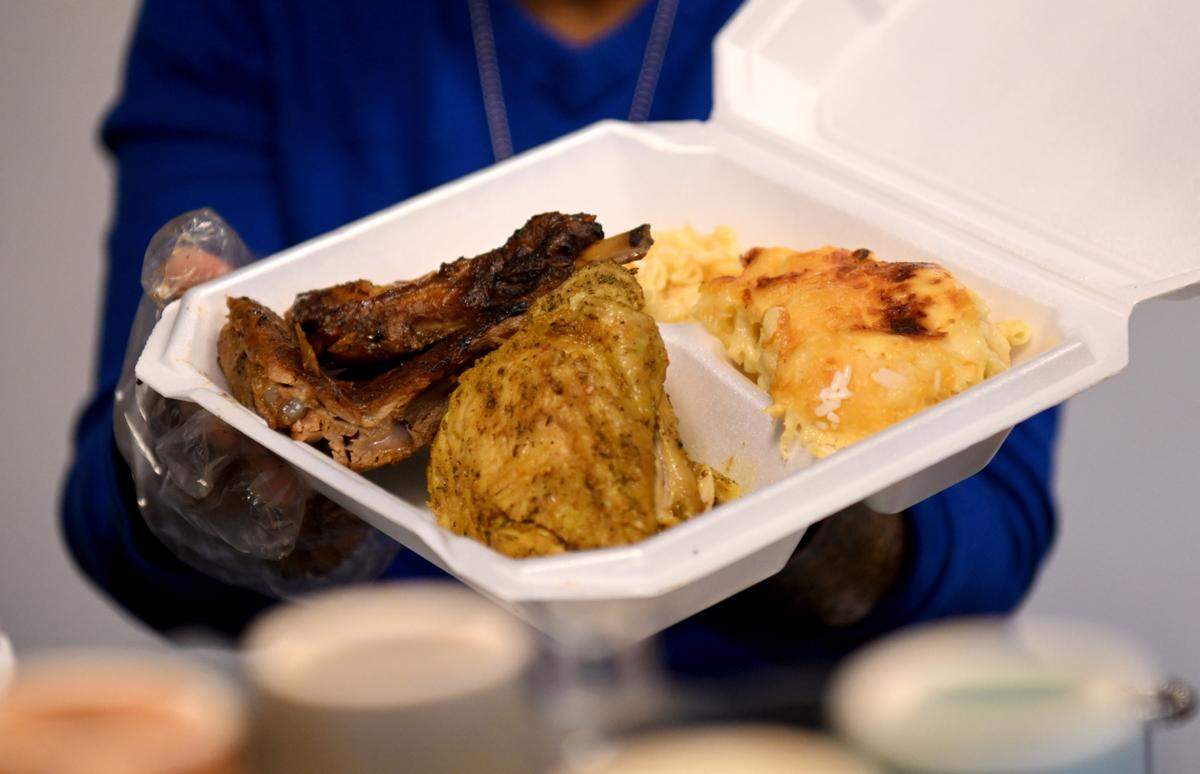 An order that includes jerk chicken, ribs and mac and cheese at Coffee, Hemp and Tea on Saturday, Jan. 20, 2024.