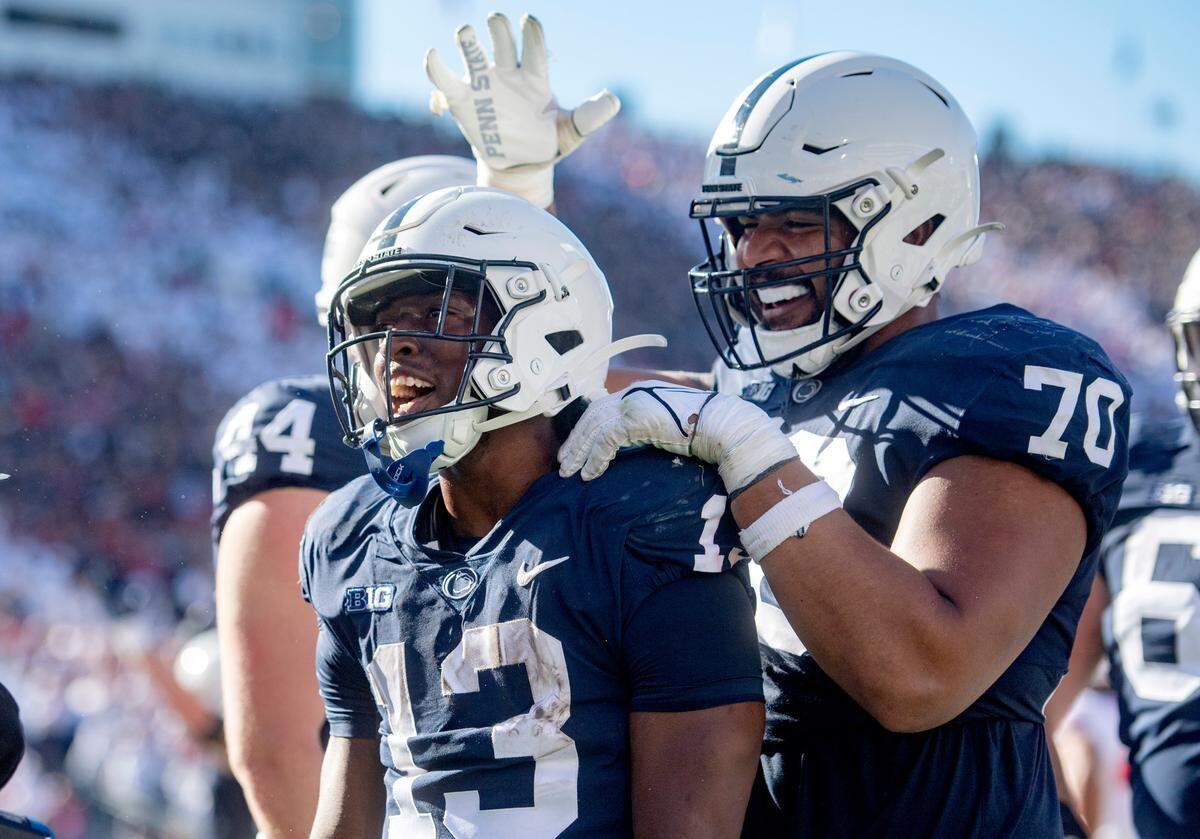 Penn State offensive lineman Juice Scruggs congratulates running back Kaytron Allen after his touchdown during the game against Ohio State on Saturday, Oct. 29, 2022.