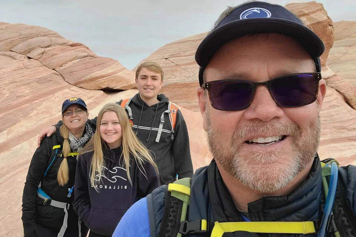 Nick Feinstein, who passed away Saturday, stands third from left while posing for a photo with family.