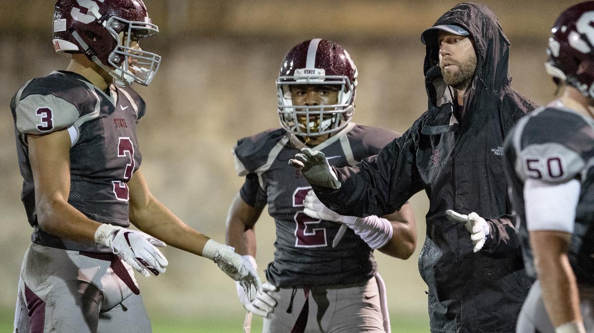 State College football coach Matt Lintal, seen in a file photo with Keaton Ellis and Cohen Russell, said his team’s quick start “gave us a lot of momentum.”