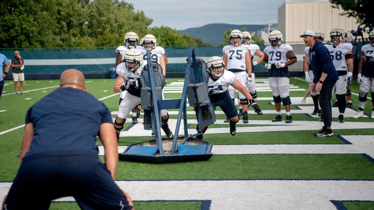 Penn State football coach James Franklin watches the offensive line run drills during practice on Wednesday, Aug. 10, 2022.
