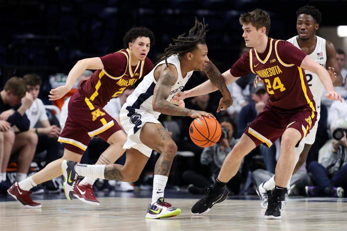 Feb 4, 2025; University Park, Pennsylvania, USA; Penn State Nittany Lions guard Ace Baldwin Jr (1) dribbles the ball towards the basket as Minnesota Golden Gophers guard Brennan Rigsby (24) defends during the second half at Bryce Jordan Center. Minnesota defeated Penn State 69-61. Mandatory Credit: Matthew O'Haren-Imagn Images