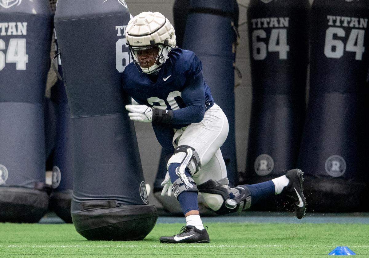 Penn State defensive end Adisa Isaac runs a drill during spring practice on Wednesday, March 30, 2022.