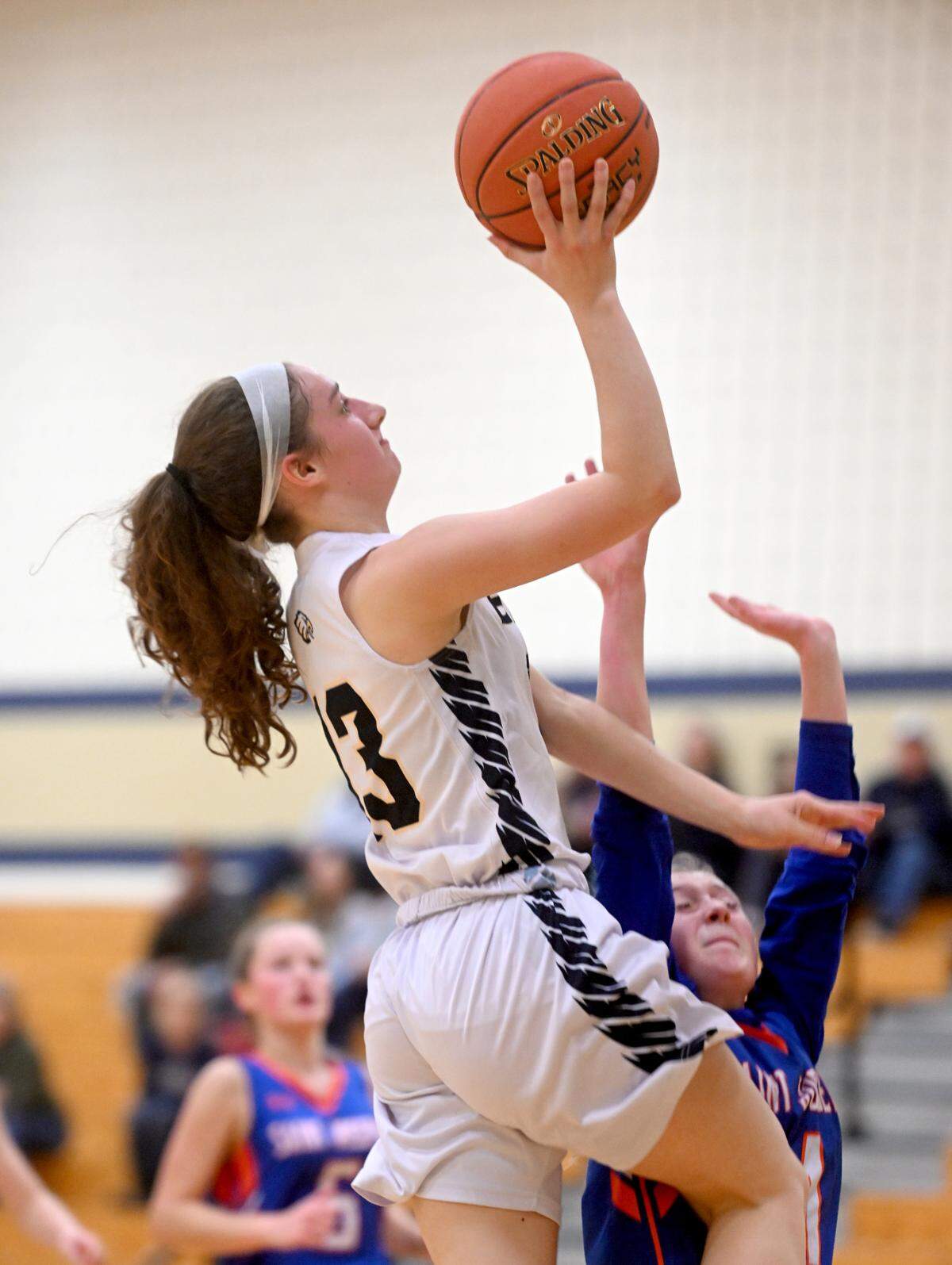 Bald Eagle Area’s Taylor Habovick goes in for a basket over Saint Joseph defenders during the game on Tuesday.