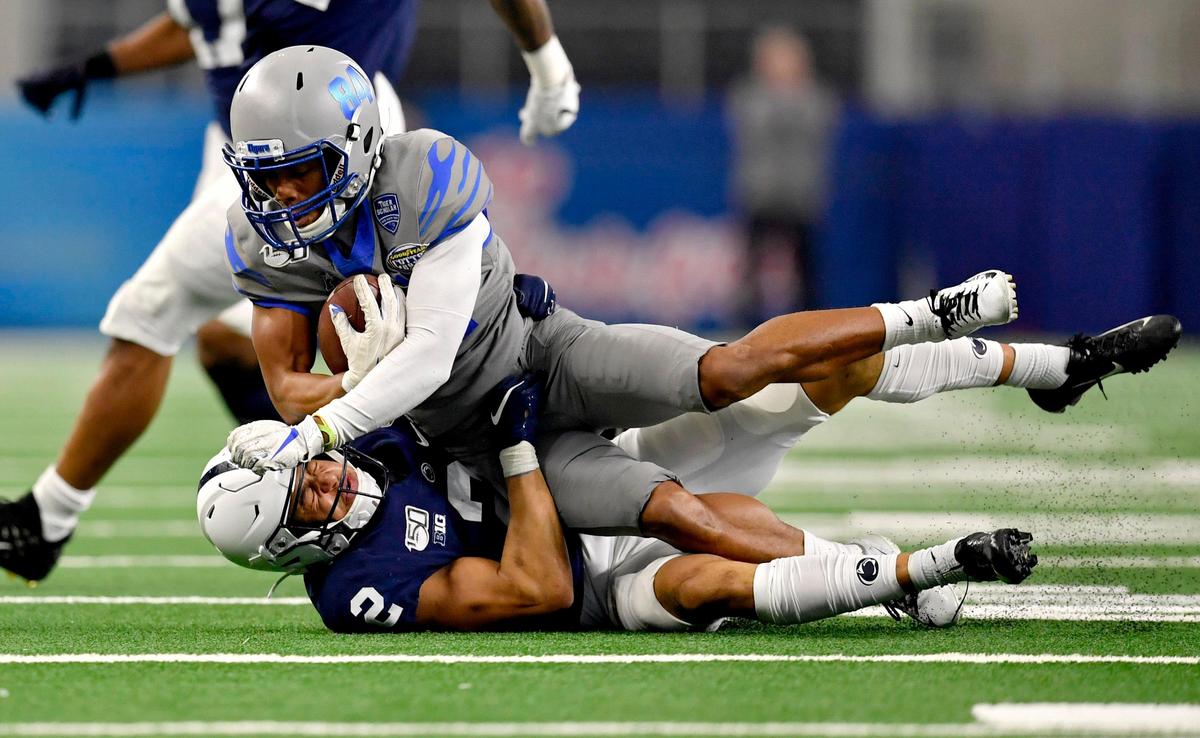 Penn State cornerback Keaton Ellis pulls down Memphis wide receiver Calvin Austin III during the 84th Goodyear Cotton Bowl Classic AT&T Stadium in Arlington, TX on Saturday, Dec. 28, 2019.
