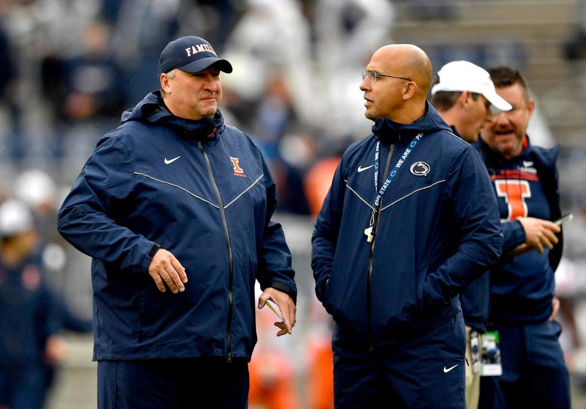 Illinois coach Bret Bielema chats with Penn State football coach James Franklin before the game on Saturday, Oct. 23, 2021 at Beaver Stadium.