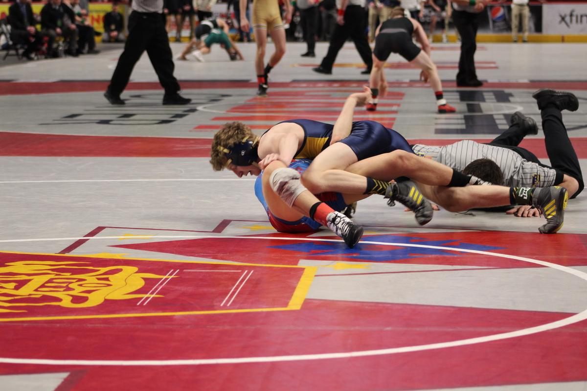 Bald Eagle Area’s Lucas Fye looks for the fall on West Branch’s Landon Bainey in their 113-pound fifth-place match of the PIAA Class 2A Championships on Saturday, March 12, 2022 at Giant Center in Hershey. Fye won, 5-2, for his first varsity win over Bainey.