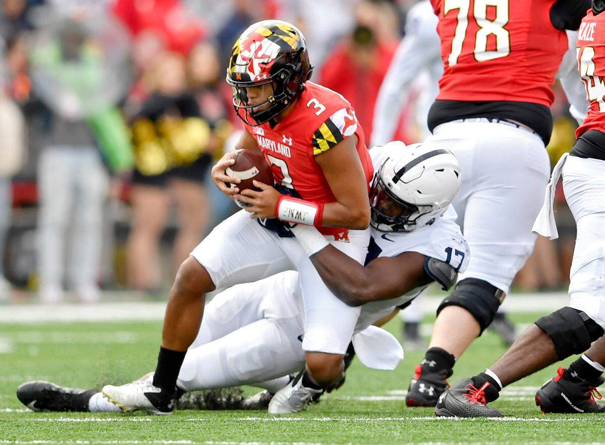 Penn State defensive end Arnold Ebiketie sacks Maryland quarterback Taulia Tagovailoa during the first quarter of the game on Saturday, Nov. 6, 2021.