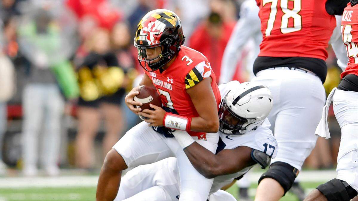 Penn State defensive end Arnold Ebiketie, of Silver Spring, Maryland, sacks Maryland quarterback Taulia Tagovailoa during the first quarter of the game on Saturday, Nov. 6, 2021.