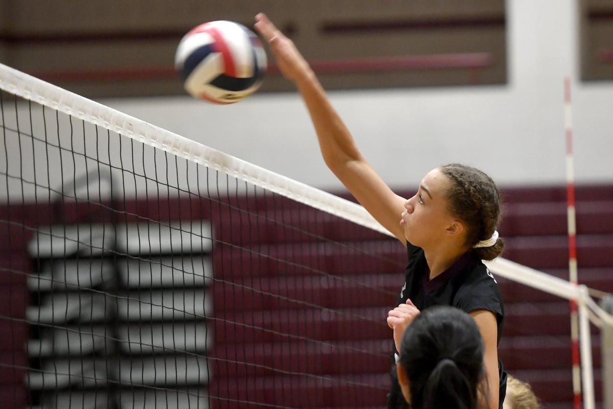 State College’s Vanessa McGhee knocks the ball over the net during the match against Red Land on Thursday, Sept. 26, 2019.