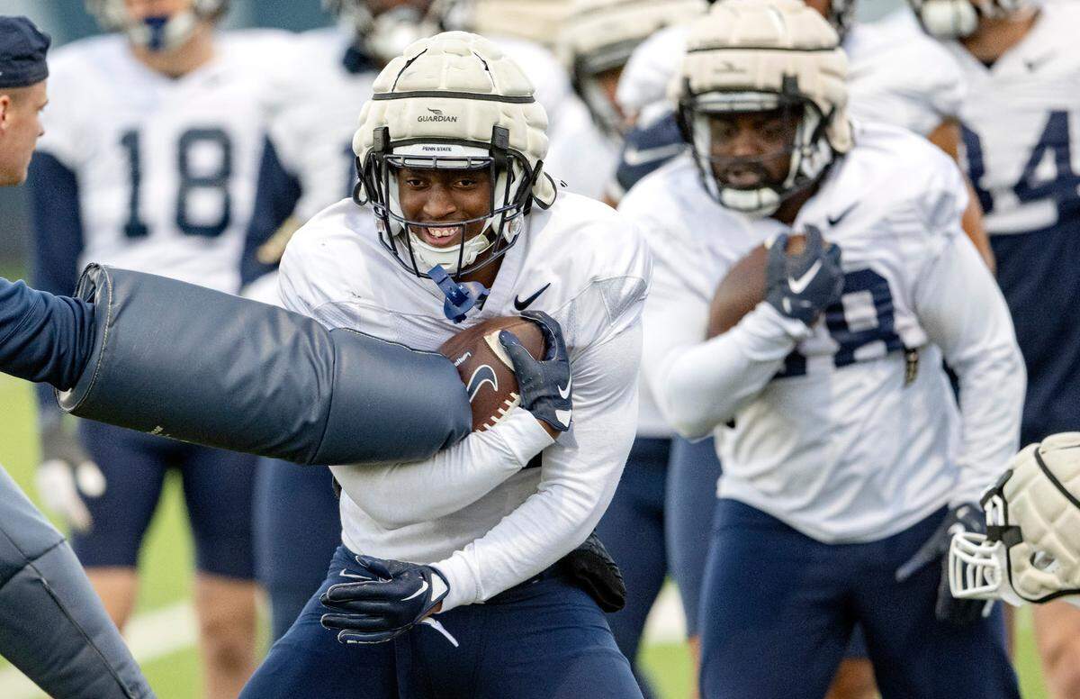 Penn State running back Kaytron Allen runs a ball security drill during practice on Wednesday, Nov. 9, 2022.