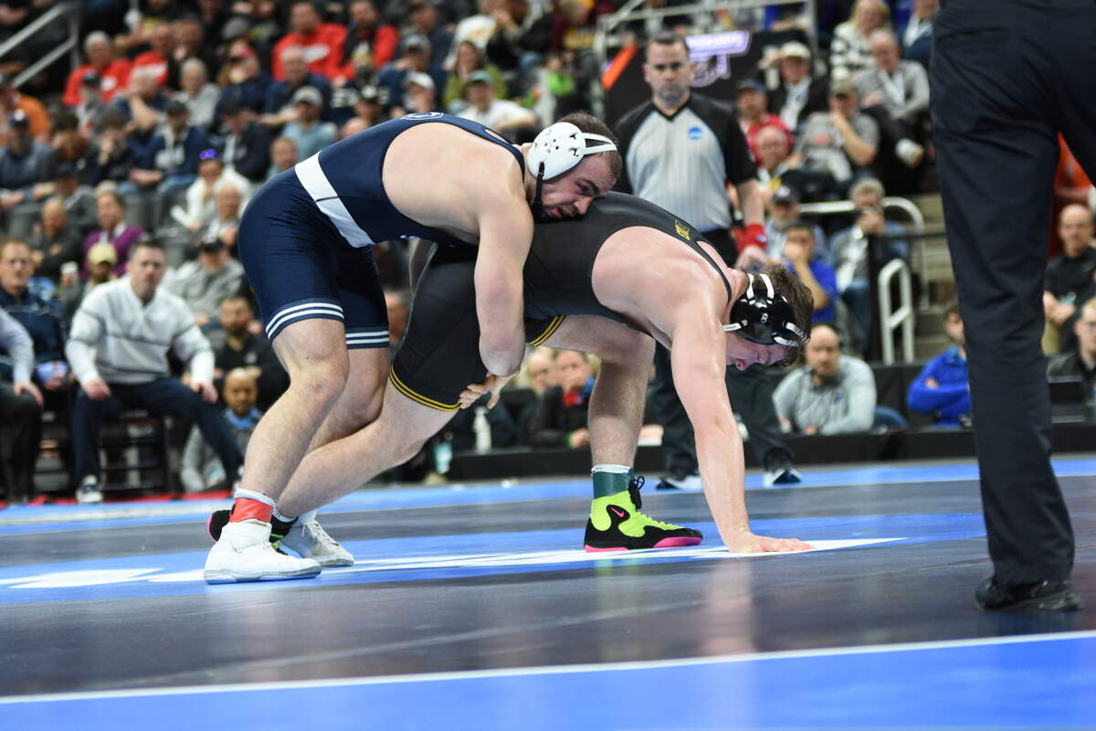 Penn State’s Max Dean controls Iowa’s Jacob Warner in their 197-pound finals match of the NCAA Championships on Saturday, March 19, 2022 at Little Caesars Arena in Detroit. Dean edged Warner, 3-2, to claim his first NCAA title.