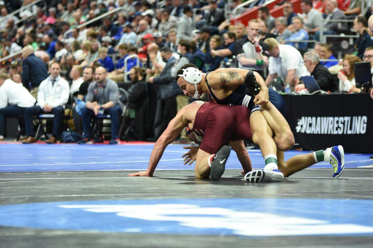 Penn State’s Aaron Brooks controls Virginia Tech’s Hunter Bolen in their 184-pound second round match of the NCAA Championships on Thursday, March 17, 2022 at Little Caesars Arena in Detroit. Brooks topped Bolen, 9-1.
