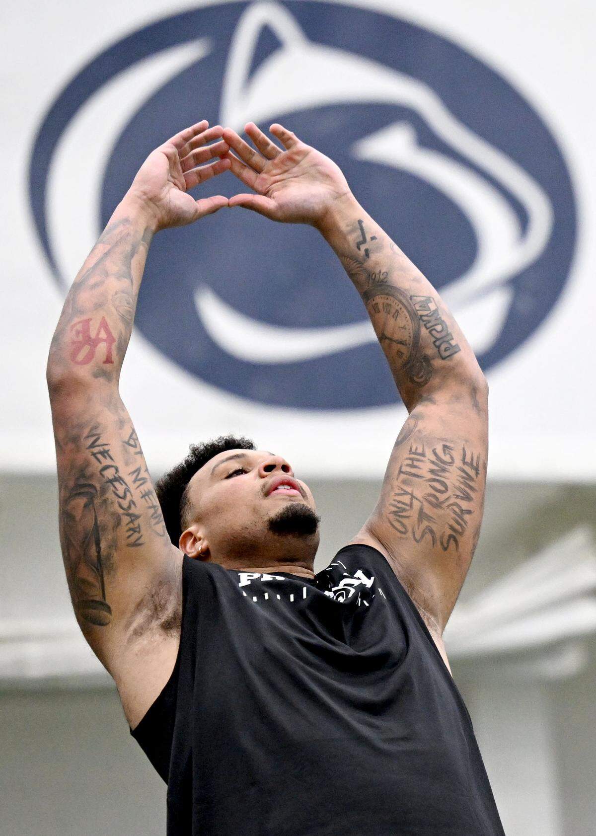 OL Nick Dawkins swings his arms as he prepares to do the broad jump during Penn State Pro Day on Wednesday, March 18, 2026. His best jump was 9-4.