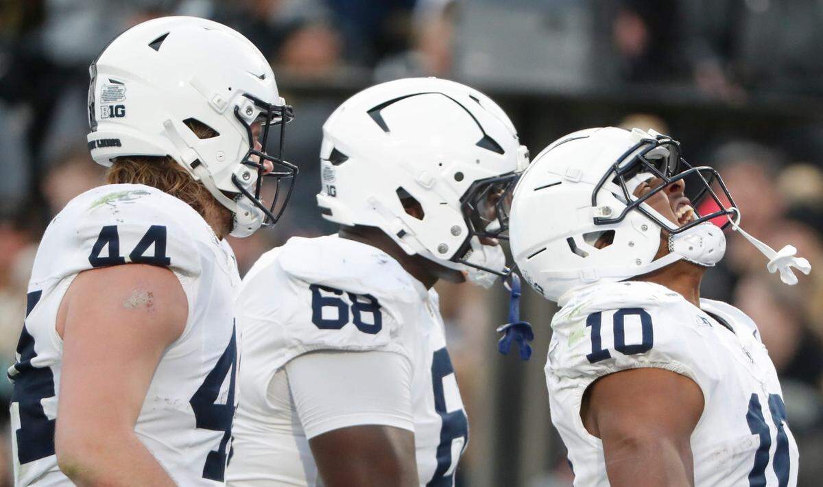 Penn State Nittany Lions running back Nicholas Singleton (10) celebrates with Penn State Nittany Lions tight end Tyler Warren (44) and Penn State Nittany Lions offensive lineman Anthony Donkoh (68) after scoring a touchdown Saturday, Nov. 16, 2024, during the NCAA football game against the Purdue Boilermakers at Ross-Ade Stadium in West Lafayette, Ind.