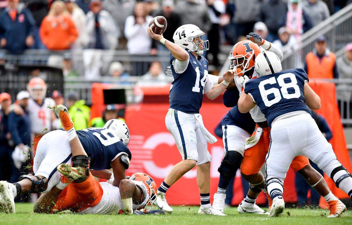 Penn State quarterback Sean Clifford tries to make a pass during overtime of the game on Saturday, Oct. 23, 2021.