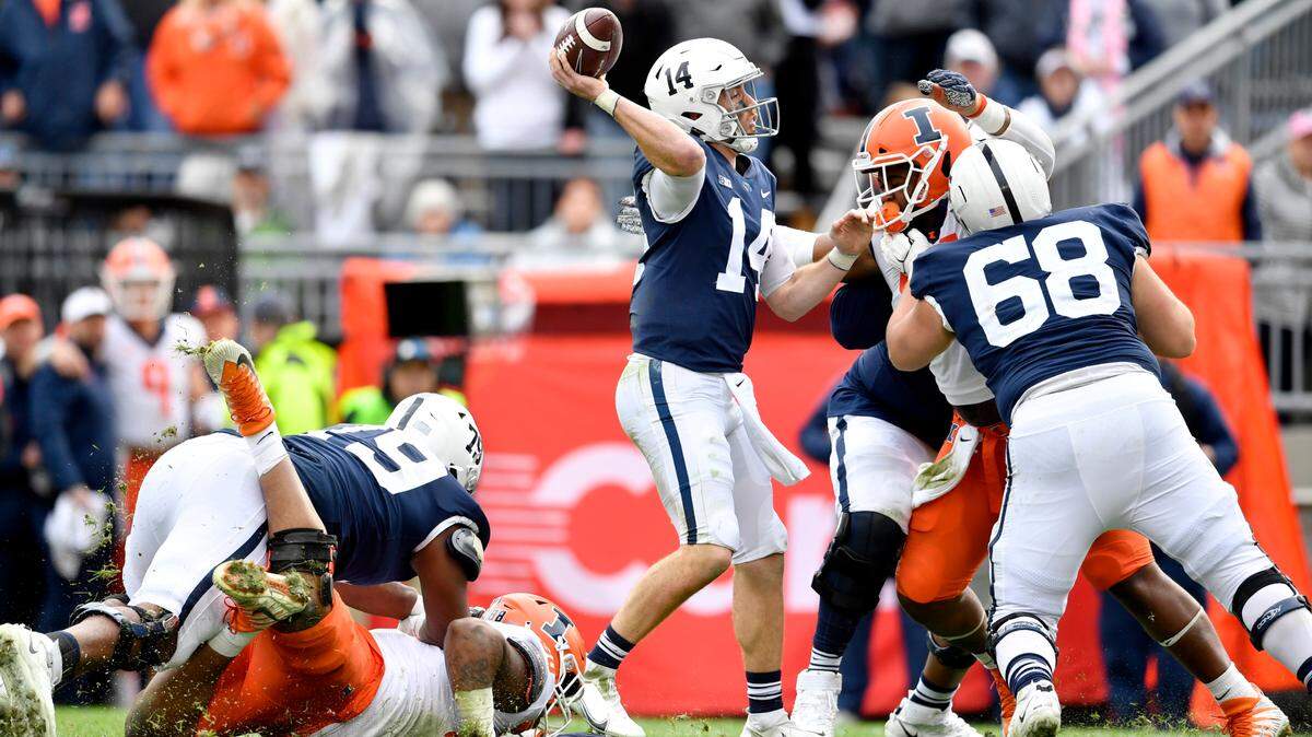 Penn State quarterback Sean Clifford tries to make a pass during overtime of the game on Saturday, Oct. 23, 2021.