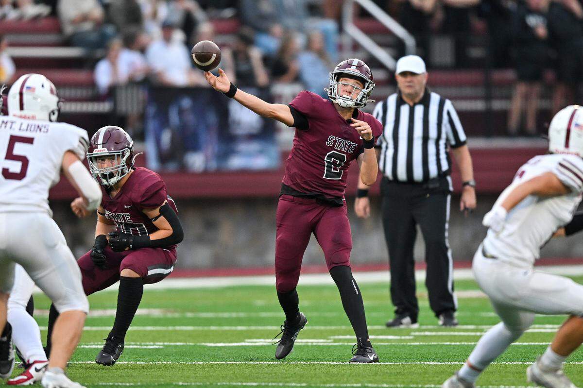 State College quarterback Eddie Corkery finds an opening for another completed pass against Altoona on Friday, Aug. 30, 2024.  