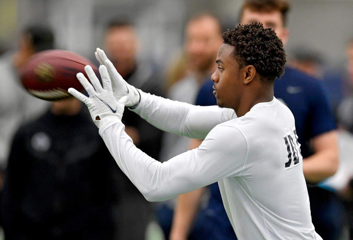 Wide receiver Jahan Dotson warms up during Penn State pro day on Thursday, March 24, 2022.