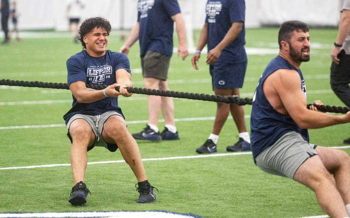 Penn State linebackers Tony Rojas and Dom DeLuca compete in tug-of-war against the offense during the 21st Annual Lift for Life to benefit Uplifting Athletes on Thursday, June 13, 2024 in Holuba Hall.