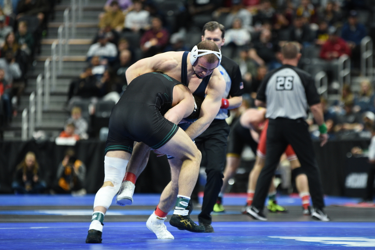 Penn State’s Max Dean aims to fight off a shot attempt from Binghamton’s Lou DePrez in their 197-pound quarterfinals match of the NCAA Championships on Friday, March 18, 2022 at Little Caesars Arena in Detroit. Dean snuck by DePrez, 4-3.