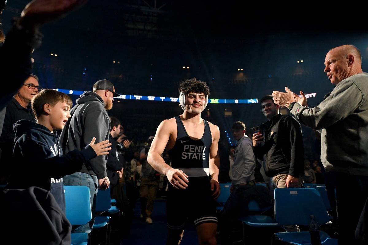 Penn State’s Beau Bartlett runs through the crowd for his 141 lb bout in the match against Michigan on Friday, Feb. 7, 2025 in the Bryce Jordan Center.
