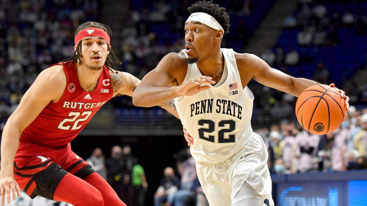 Penn State’s Jalen Pickett dribbles around Rutgers’ Caleb McConnell during the first half of the game on Tuesday, Jan. 11, 2022 at the Bryce Jordan Center.