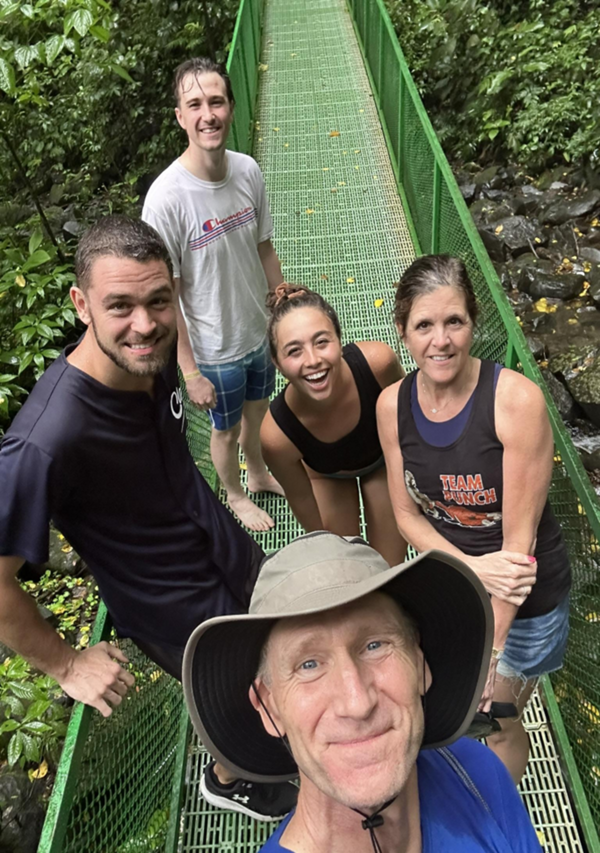 The writer in front with two of his sons (Alex to left, Aidan in back); wife Denise on right, and Alex’s girlfriend, Courtney, in middle). This picture was taken in middle of rainforest hike in Costa Rica in April, with Alex serving as Spanish translator.