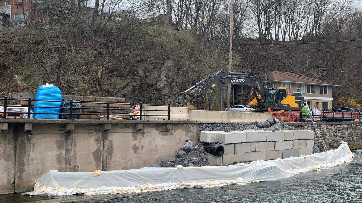 Work to repair a partially collapsed wall along a busy thoroughfare in Bellefonte is underway Friday. Construction is expected to be completed in early August.