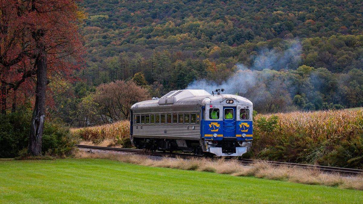 Volunteers from the Bellefonte Historical Railroad Society celebrated Monday the restoration of one of its rail cars, a decade-long process that will bring train rides back to Bellefonte.