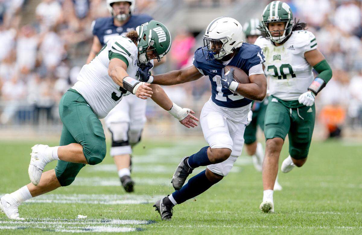 Penn State running back Kaytron Allen runs from Ohio defenders during the game on Saturday, Sept. 10, 2022.