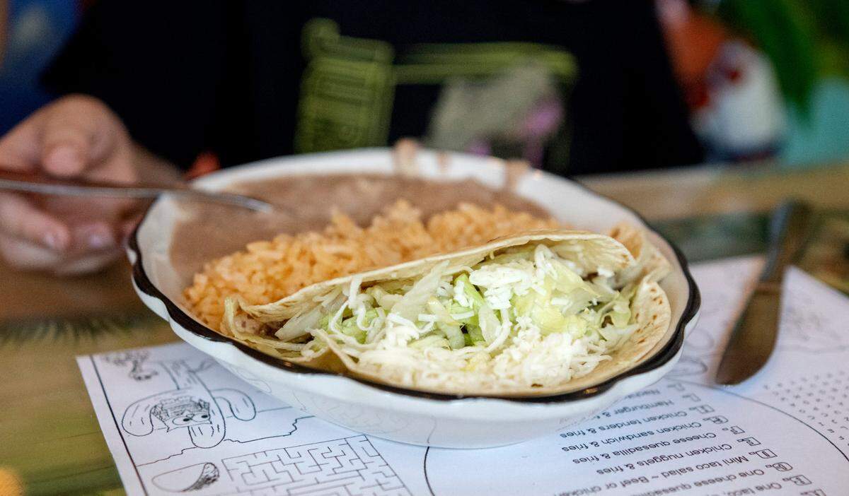 A kids meal featuring one taco, Spanish rice and refried beans at Rey Azteca on Monday, June 26, 2023.
