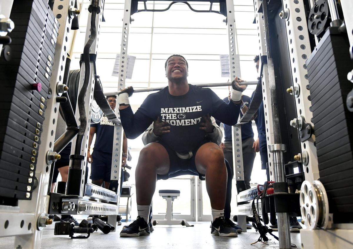 Penn State defensive tackle PJ Mustipher squats during a strength training session on Thursday, Feb 28, 2019.