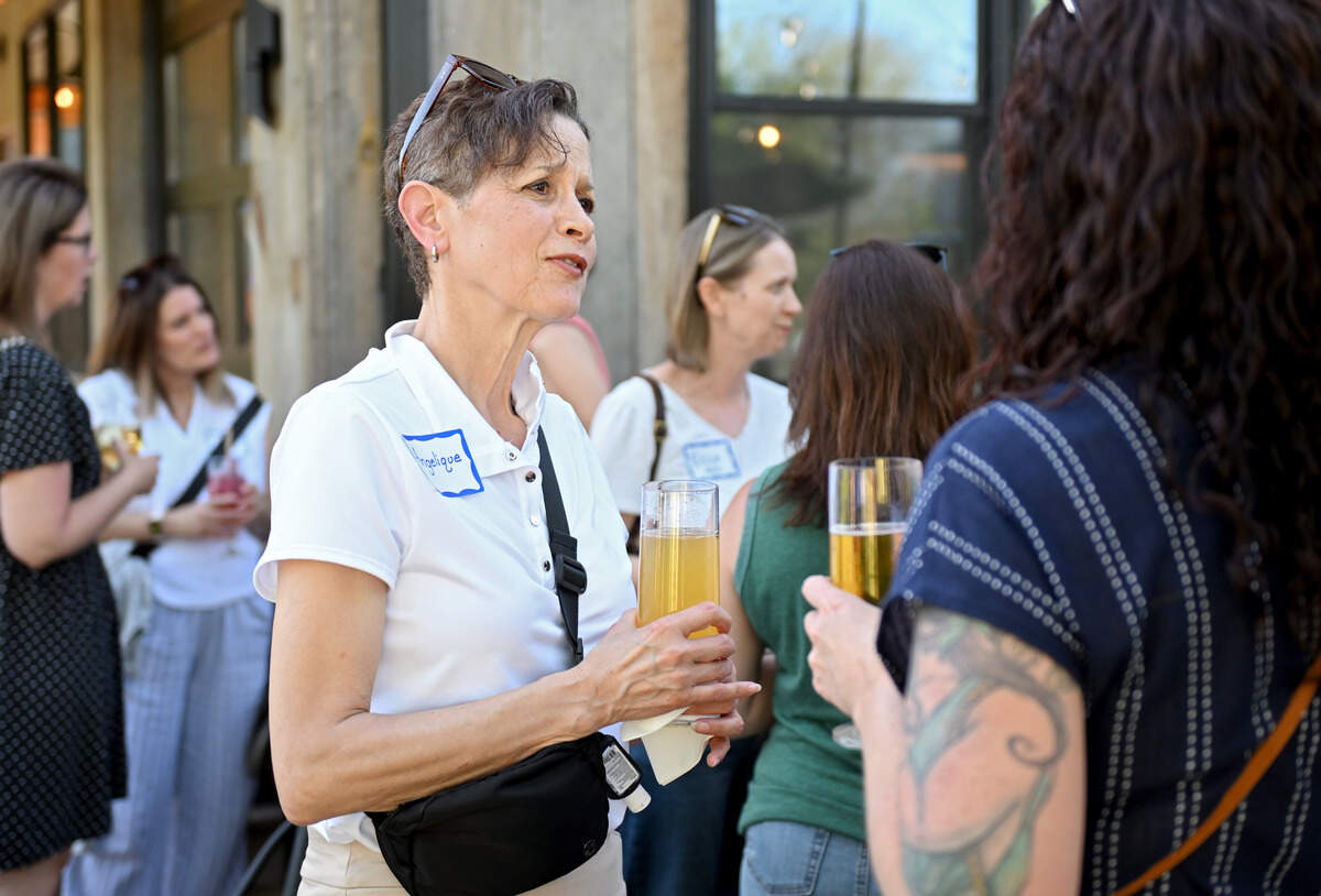Angelique Bacon-Woodard chats with other women at the Happy Valley Changemakers Lifestyle and Community Collective on Wednesday, June 3, 2026 at Boal City Brewing.